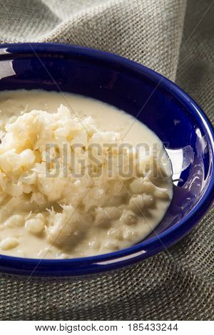 Brazilian Dessert Canjica Our Mungunza Of White Corn In Blue Bowl