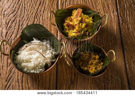 Rice With Coconut, Yellow Flour And  Dried Meat With Rice In An Old Copper Pot - Traditional Bahia F