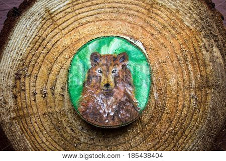 Painted Forest Animal On A Cut Piece Of Wood. Beautiful Natural Paint Colors. Background Of Brown Wo