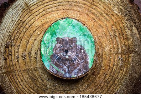 Painted Forest Animal On A Cut Piece Of Wood. Beautiful Natural Paint Colors. Background Of Brown Wo