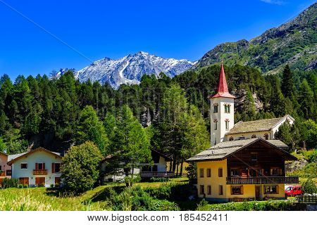 Picturesque village of Maloya near St. Moritz under a clear blue sky in summer (Engadin Grisons Switzerland)