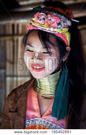 Thailand North Chiang Rai - January 2016: a girl of the Padaung tribe smiling in a traditional national village.