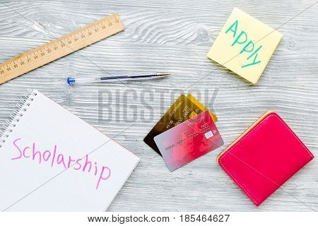 scolarship apply with credit cards and wallet on white table background top view