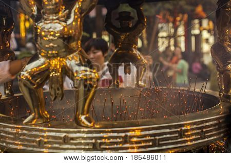 Taipei Taiwan - 6 October 2012: People praying and lighting incense at Longshan Temple in the center of the city