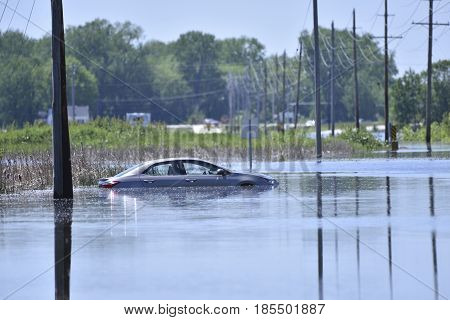 Stranded Car On A Flooded Road