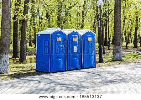 Samara Russia - May 7 2017: Mobile public toilets at the city park in summer sunny day