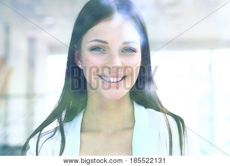 business woman looking thtough window in the office