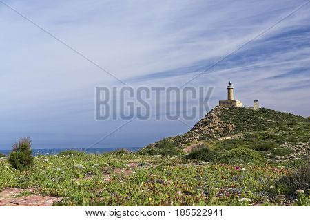 Capo Sandalo Lighthouse on the Westernmost point os St Pietro Island. Southwestern corner of Sardinia Italy