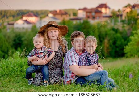 funny sibling on the background of the village