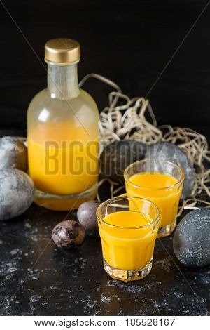 Traditional Italian Yellow Egg Liquor, Bombardino. Dark Backgrou