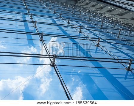 Architecture details Modern Building Glass facade reflection Sky