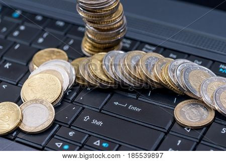 euro cin on laptop business concept close up