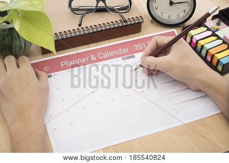 business hand list Calender Planner meeting on desk office. organization management remind concept.