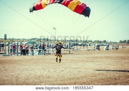 Parachute jumper on a wing parachute execute a controlled descent by parachute