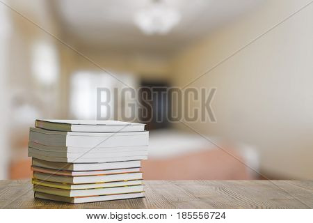 books on old wooden table in the bedroom
