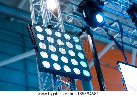 Light tower lit at a stadium during nightime