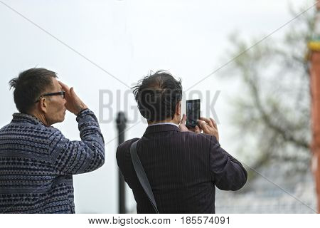 Moscow, Russia - May, 7, 2017: Tourists photograph on Red Square in a center of Moscow