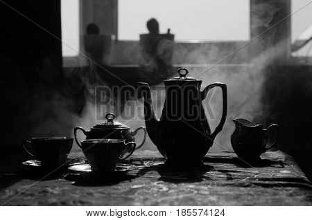 Food Background Tea And Coffee Theme. Old Vintage Ceramic Tea Or Coffee Pot With Cups Jug And Sugar