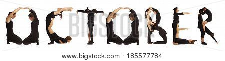 Black dressed people forming word OCTOBER on white background