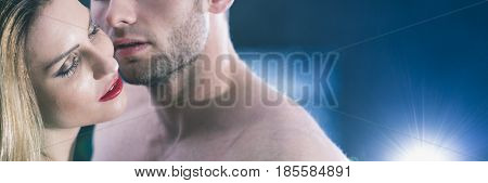 Young romantic couple kissing naked, panoramic view