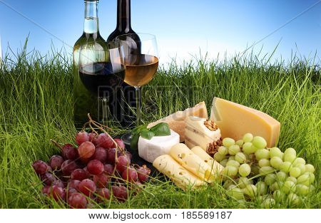 Cheese Platter And Wine With Different Cheese And Grapes