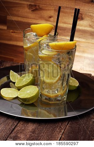 Lemonade With Fresh Lemon On Wooden Background