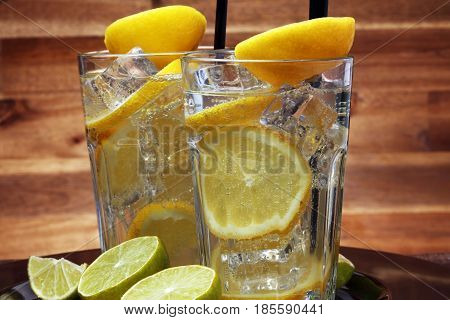 Lemonade With Fresh Lemon On Wooden Background