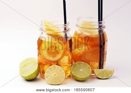 Iced Tea With Lemon Slices And Mint On White Background