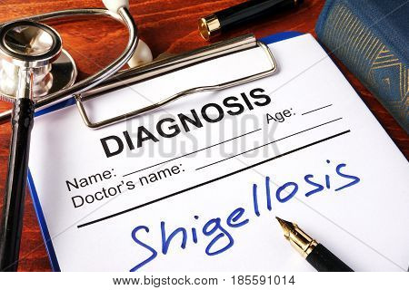 Medical form with diagnosis Shigellosis on a clipboard.