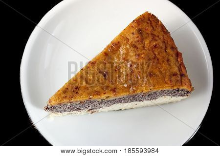 Photo of homemade poppy seed cake made from paleo and vegetarian friendly ingredients. Healthy snack without added sugar gluten and milk.