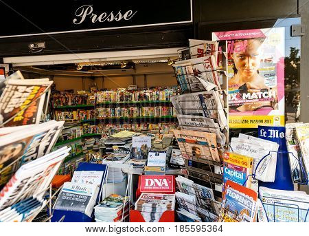 PARIS FRANCE - MAY 9 2017: French Press Kisok with international newspapes with the picture of the newly elected French president Emmanuel Macron after the second round French Presidential election