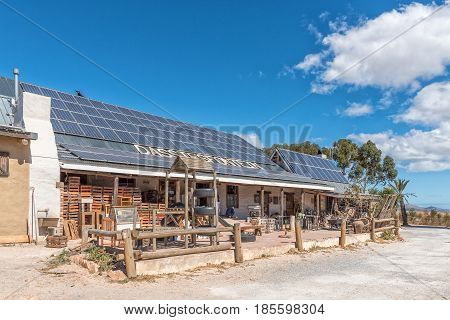 DASSIEFONTEIN SOUTH AFRICA - MARCH 27 2017: The Dassiefontein Road Stall with solar panels on its roof next to the N2-Road between Caledon and Botrivier in the Western Cape Province