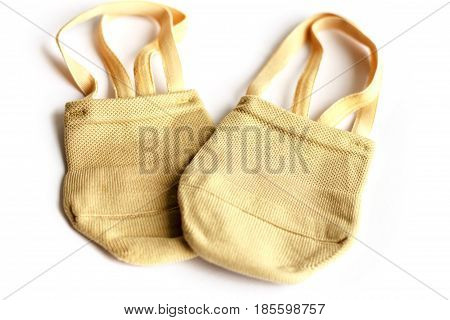 Rhythmic gymnastics shoes worn on white background.