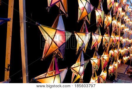 Multi colored star lamps and background .