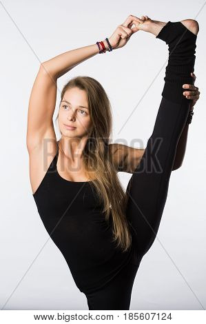sports exercise isolated on white background. Beautiful woman dressed in sportswear, doing stretching legs. view from the back.