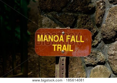Manoa Falls Trail sign on Oahu Hawaii. Manoa Falls is one of the most popular hikes on the island and brings in tourists from all over the world.