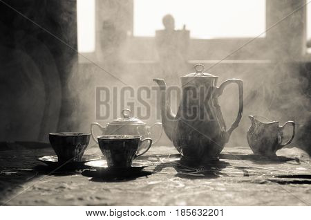 Food Background Tea And Coffee Theme. Old Vintage Ceramic Tea Or Coffee Pot With Cups Jug And Sugar