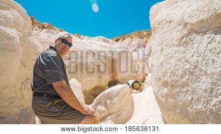 Little girl on a weekend hike with her dad in Paint Mines Interpretive Park in Colorado.