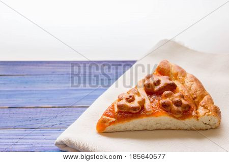 A piece of cake with orange confiture on a wooden table. Delicious dessert.