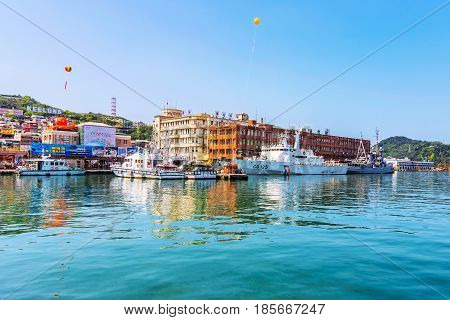 KEELUNG TAIWAN - APRIL 04: This is the a view of the Keelung harbor seafront with boats and the main station area on April 04 2017 in Keelung