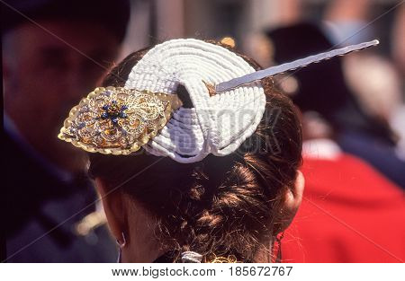 Woman With A Traditional Fixing Hair On Her Head