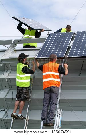 Workers During The Installation Of Solar Panels