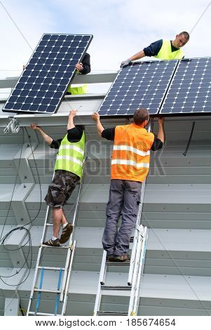 Workers During The Installation Of Solar Panels