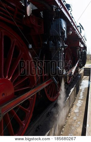 BERLIN - APRIL 21: Detail of an old steam locomotive Spring Festival Exhibition in the Rail yard Schoeneweide April 21 2013 in Berlin Germany