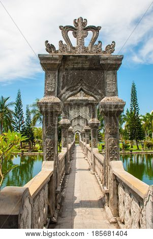 Water Palace Udjung. The Bridge Over The Pond. Bali, Indonesia