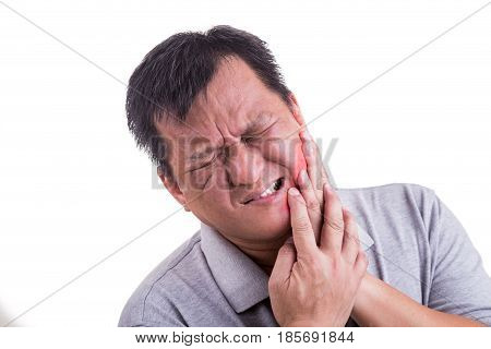 Matured Man Suffering Intense Toothache Pain With Hands Over Face
