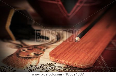 Burning incense close up with holder and deer napkin