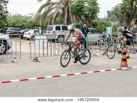 Nahariyya Israel - May 06 2017 : Participant of the annual triathlon starts from the start in the competition in cycling in Ahziv near the town of Nahariya