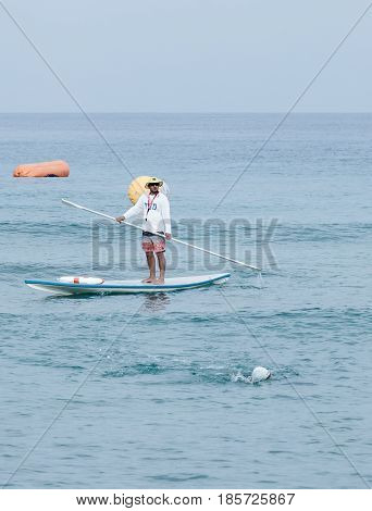 Nahariyya Israel - May 06 2017 : Rescuer on the lifeboat watches the participants of the annual triathlon which participate in a swim in the Mediterranean Sea in Ahziv near the town of Nahariya