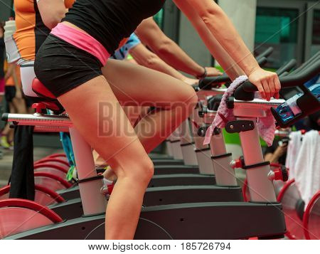 Group Of Boys And Girls At Gym: Workout With Spinning Bikes